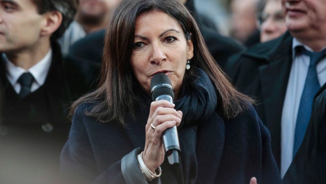 The mayor of Paris, Anne Hidalgo, speaks during the presentation of the new Trilib selective recycling bins and containers in Paris on Dec. 5, 2016.