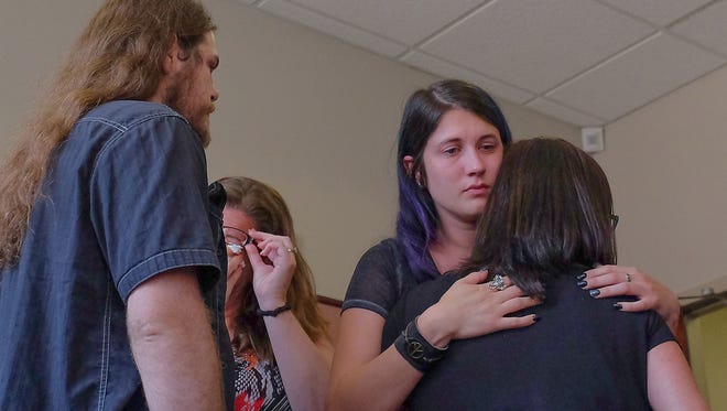 Victoria King, center, is comforted by friends and family after court was adjourned in the murder trial of Thomas McClellan on Thursday, July 20, 2017. McClellan has confessed to killing King’s daughter Luna Younger in November 2016.