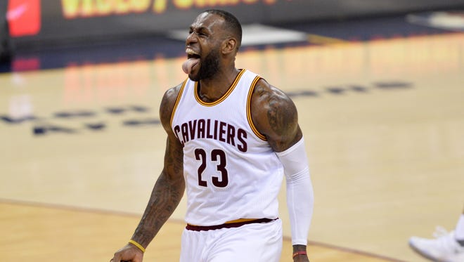 LeBron James celebrates after a stoppage in play against the Detroit Pistons during the second quarter in game two of the first round of the NBA Playoffs at Quicken Loans Arena.