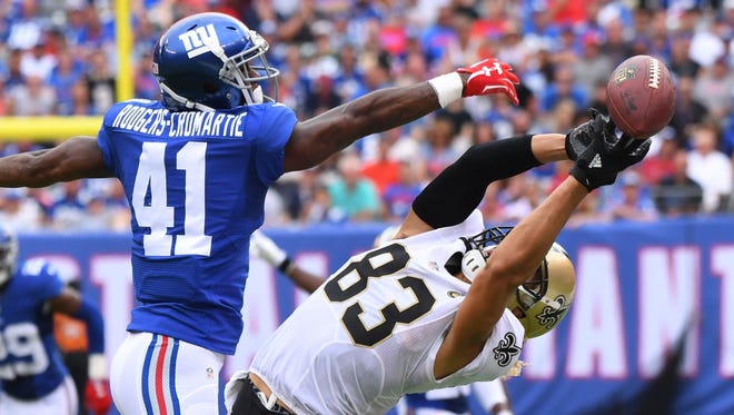 Saints receiver Willie Snead (83) can't bring in a first-half pass against Giants defender Dominique Rodgers-Cromartie (41).