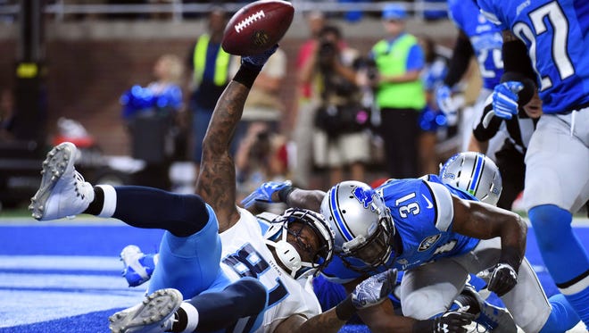 Titans receiver Andre Johnson (81) hauls in the game-winning touchdown catch late in the fourth quarter to beat the Lions.