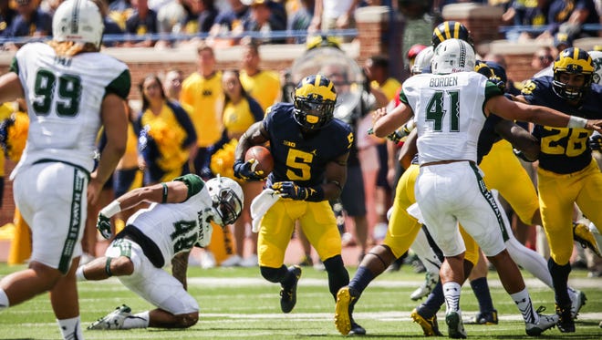 Michigan Wolverines linebacker Jabrill Peppers returns a punt against Hawaii during the opener at Michigan Stadium in Ann Arbor, Michigan, on Saturday, September 3, 2016.