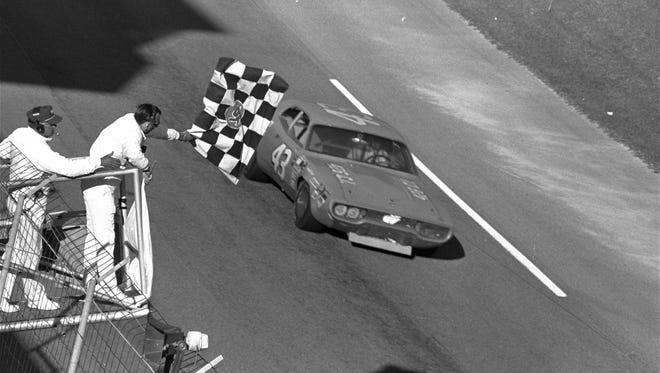 Richard Petty receives the checkered flag to win the Daytona 500 in 1971.