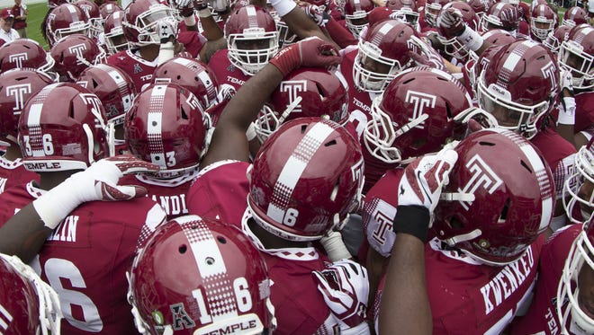 PHILADELPHIA, PA - SEPTEMBER 24: The Temple huddle prior to their game against the Charlotte at Lincoln Financial Field.