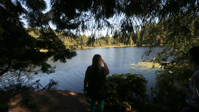 Teri Allen, a broker with Karen Kay Properties, looks out at the swimming hole on Clark Island on Monday, July 24, 2017.