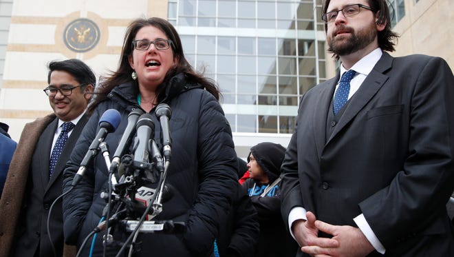 Becca Heller of the International Refugee Assistance Project speaks to reporters outside federal court in Beltsville, Md., on March 15, 2017, about a challenge to President Trump's revised travel ban.