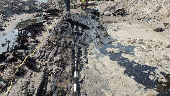 Parts of an exposed hull belonging to a century-old shipwreck uncovered in 2014 at Barnegat Inlet.