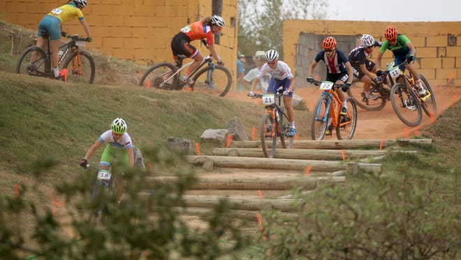Riders compete in the women's cross country cycling mountain bike event during the Rio 2016 Summer Olympic Games at Mountain Bike Centre.