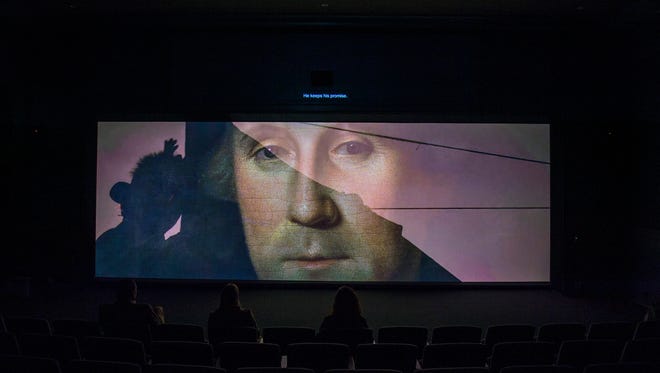 A preview of a multimedia presentation which unveils George Washington's tent is played inside a theater at the upcoming Museum of the American Revolution Friday, March 24 in Philadelphia. The museum opens April 19, 2017.