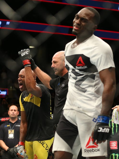 Anderson Silva (red gloves) celebrates after his victory against Derek Brunson (blue gloves) during UFC 208 at Barclays Center.
