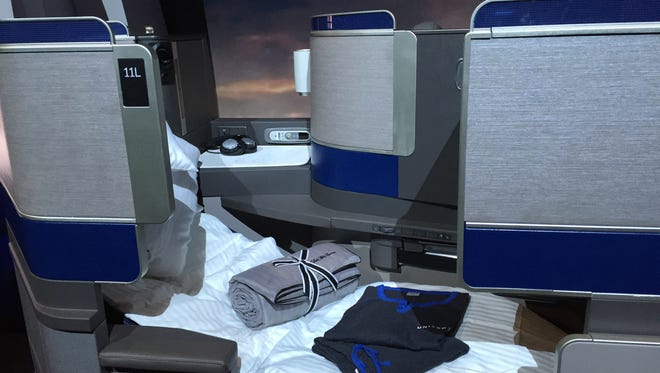 United's new custom designed lie flat seat extends up to six and a half feet and includes linen from Saks Fifth Ave. Pajamas are included for flights longer than 12 hours.