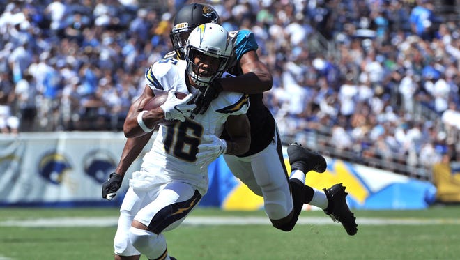 Chargers receiver Tyrell Williams (16) tries to elude Jaguars defender Jalen Ramsey (20) after a first-half catch.