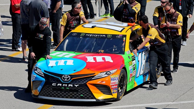 The car of NASCAR Cup Series driver Kyle Busch (18) is pushed in the garage prior to the 2017 Daytona 500 at Daytona International Speedway.