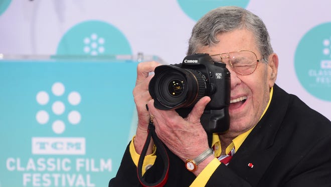 Jerry Lewis documents the working press at his Hand and Footprint ceremony at the TCL Theater in Hollywood, Calif. on April 12, 2014.