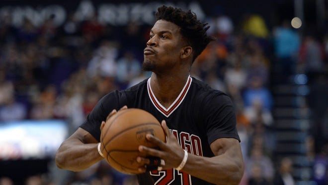 Chicago Bulls forward Jimmy Butler (21) shoots the ball against the Phoenix Suns during the second half at Talking Stick Resort Arena.