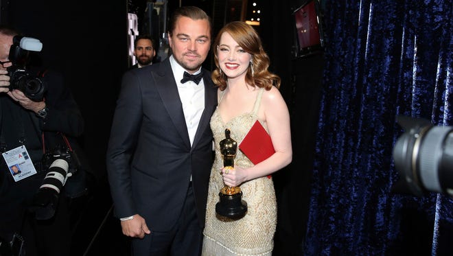 Leonardo DiCaprio, left, and Emma Stone, winner of the award for best actress in a leading role for "La La Land", backstage at the Oscars.