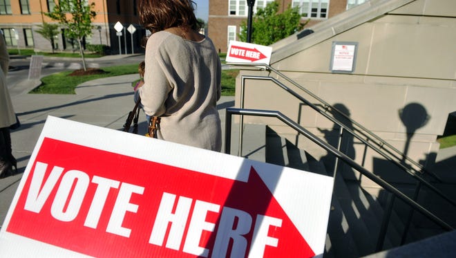 A voter leaves a polling place in April 2014 in Nashville, Tenn.
