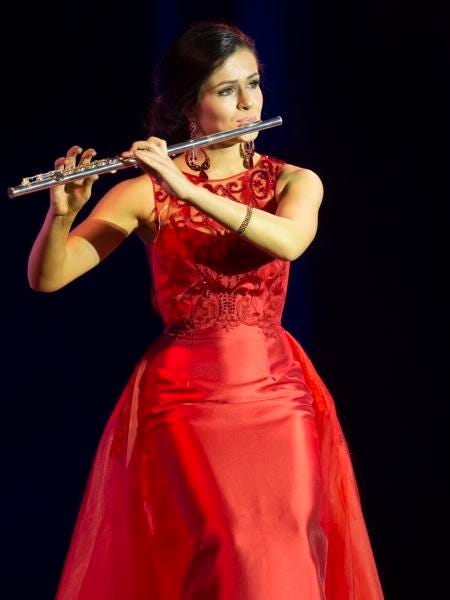 Miss La Crosse/Oktoberfest Mattie Mae Krause performs on the flute in the talent portion of Thursday's preliminary Miss Wisconsin scholarship pageant at the Alberta Kimball Auditorium June 15, 2017.