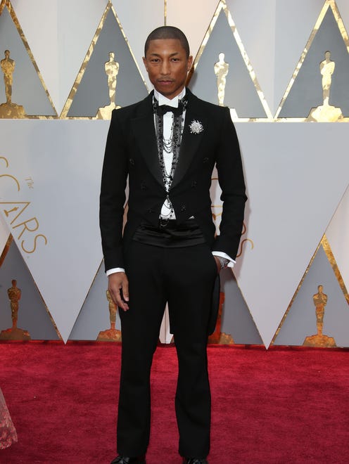 Pharrell Williams is all about Chanel in his debonair attire. (Not to mention the refined accessories)