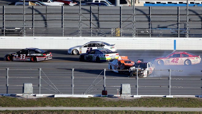 NASCAR Cup Series drivers Ty Dillon (13), Daniel Suarez (19) and Ryan Newman (31) wreck during the 2017 Daytona 500.