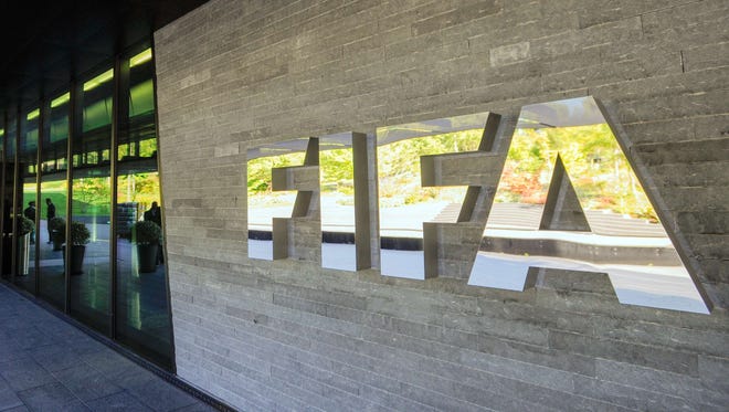File photo shows the FIFA logo outside the organization's headquarters in Zurich.