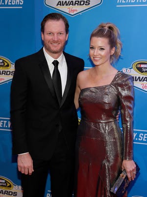 Dale Earnhardt Jr., left, and fiancée Amy Reimann pose on the red carpet before Friday's NASCAR Awards ceremony.