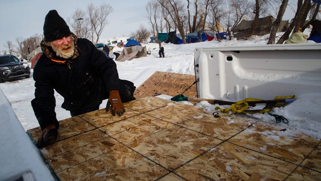 "I've been here long enough already," said Alan Winge of Red Cloud, NE as he packed up his tent at the Oceti Sakowin Camp on Wednesday, Dec. 7, 2016 near Cannon Ball. "It's getting cold," he added as many others left camp with the windchill dropping to -20.