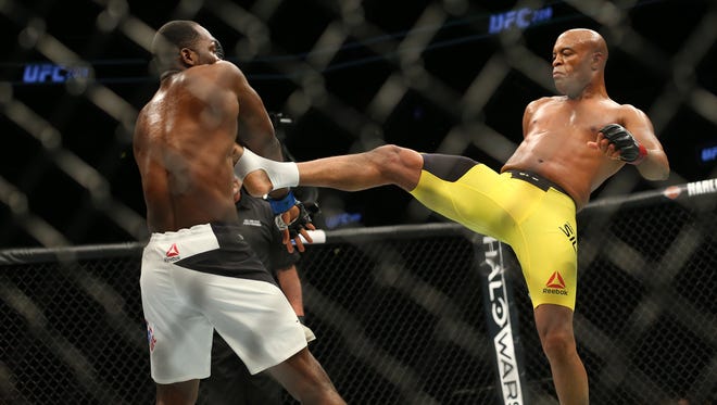 Anderson Silva (red gloves) fights Derek Brunson (blue gloves) during UFC 208 at Barclays Center.