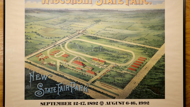 A poster marking 100 years of the Wisconsin State Fair is seen as part of a display.