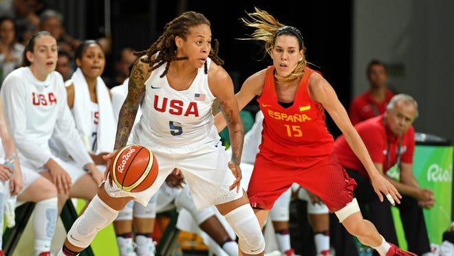 USA's Seimone Augustus dribbles against Spain in Saturday's gold medal game.