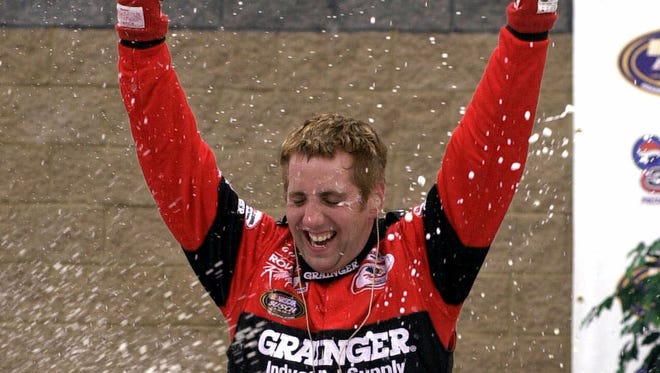 Greg Biffle celebrates after winning the NASCAR Nationwide Series Pepsi 300 in 2001, the first of his 20 career Nationwide Series wins.
