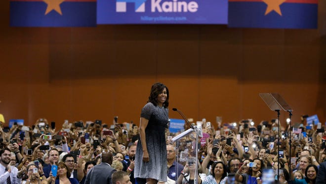 First lady Michelle Obama addresses the Arizona Democratic Party Early Vote rally at the Phoenix Convention Center on Thursday, Oct. 20, 2016, in Phoenix. Michelle Obama is campaigning for Democratic presidential nominee Hillary Clinton.