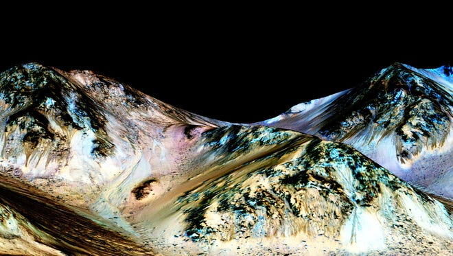 These dark, narrow, 100 meter-long streaks called recurring slope lineae flowing downhill on Mars are inferred to have been formed by contemporary flowing water. Recently, planetary scientists detected hydrated salts on these slopes at Hale crater, corroborating their original hypothesis that the streaks are indeed formed by liquid water. The blue color seen upslope of the dark streaks are thought not to be related to their formation, but instead are from the presence of the mineral pyroxene. The image is produced by draping an orthorectified (Infrared-Red-Blue/Green(IRB)) false color image (ESP_030570_1440) on a Digital Terrain Model (DTM) of the same site produced by High Resolution Imaging Science Experiment (University of Arizona). Vertical exaggeration is 1.5.
Credits: NASA/JPL/University of Arizona