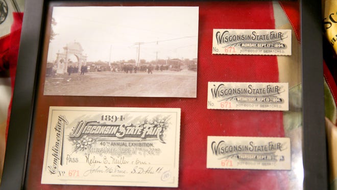 A collection of past Wisconsin State Fair entry tickets are on display as historic memorabilia.