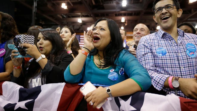 Supporters listen to first lady Michelle Obama address the Arizona Democratic Party Early Vote rally at the Phoenix Convention Center on Thursday, Oct. 20, 2016. Obama is campaigning for Democratic presidential nominee Hillary Clinton.