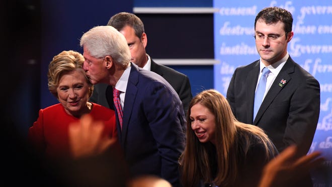 Democratic presidential candidate Hillary Clinton is greeted by family, including former President Bill Clinton, daughter Chelsea Clinton, and son-in-law Marc Mezvinsky after the first presidential debate at Hofstra University.