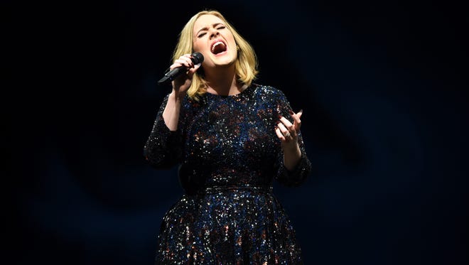 Adele performs on stage at Manchester Arena on March 7, 2016, in Manchester, England.