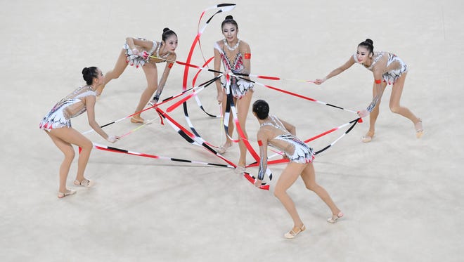 China competes during the women's rhythmic gymnastics group all-around qualification during the Rio 2016 Summer Olympic Games at Rio Olympic Arena.