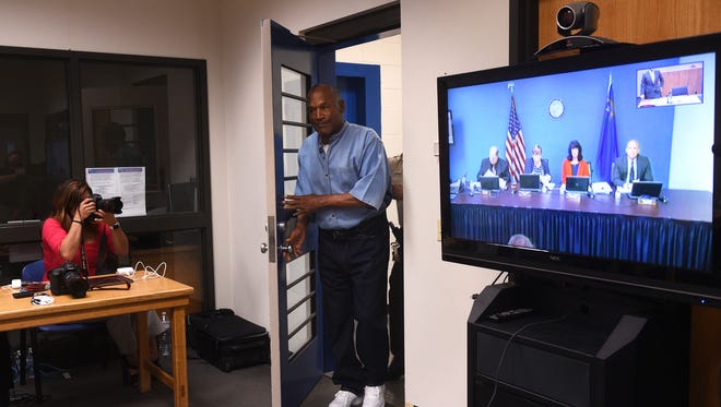O.J. Simpson enters the room during a parole hearing at Lovelock Correctional Center. Simpson is serving a nine to 33 year prison term for a 2007 armed robbery and kidnapping conviction.