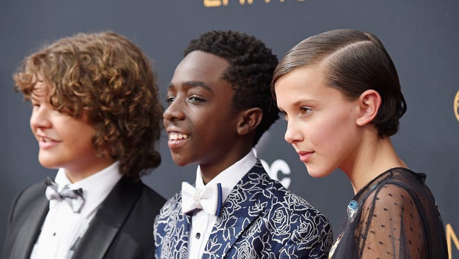 Gaten Matarazzo, Caleb McLaughlin and Millie Bobby Brown attend their first Emmys.