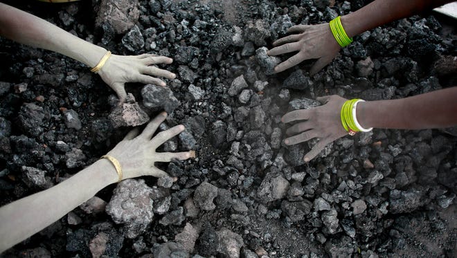 Indian women use bare hands to pick reusable pieces from heaps of used coal discarded by a carbon factory in Gauhati, India. The world’s biggest coal users - China, the United States and India - have boosted coal mining in 2017, in an abrupt departure from last year’s record global decline for the heavily polluting fuel and a setback to efforts to rein in climate change emissions.