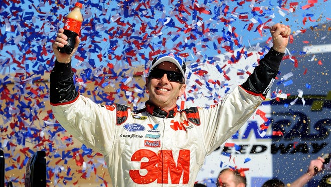 Greg Biffle celebrates after winning the Price Chopper 400 at Kansas Speedway in 2010.