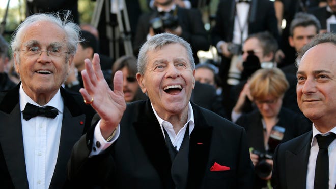 Jerry Lewis and actor Kevin Pollak arrive for the screening of Nebraska at the 66th international film festival, in Cannes, southern France on May 23, 2013.