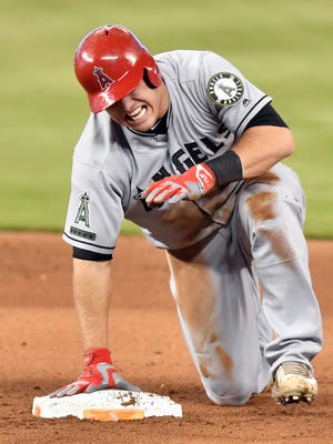 Mike Trout (27) injures his hand after sliding into second base in the fifth inning at Marlins Park.