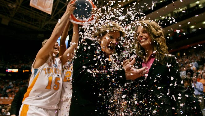 Summitt has confetti poured on her head in 2009 as she is interviewed after defeating Georgia at Thompson-Boling Arena for her 1,000th career win as head coach.