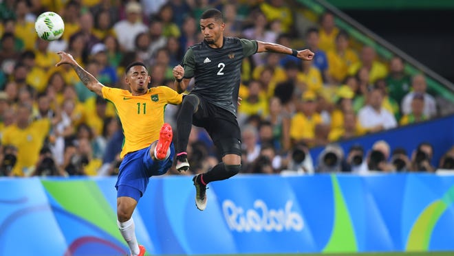 Brazil forward Gabriel Jesus (11) goes up for the ball against Germany defender Jeremy Toljan (2) in the men's gold medal match during the Rio 2016 Summer Olympic Games at Maracana.