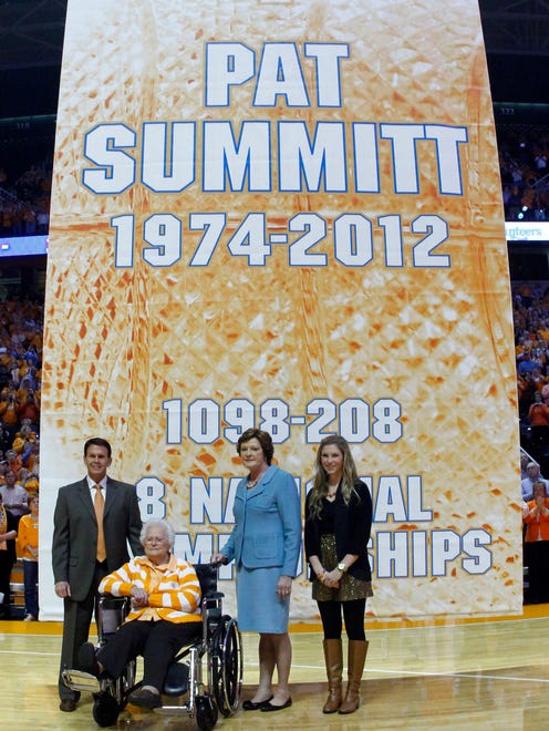 Summitt stands with Tennessee athletic director Dave Hart, left, her mother Hazel Head, seated, and future daughter-in-law AnDe Ragsdale as a banner in Summitt's honor was raised.