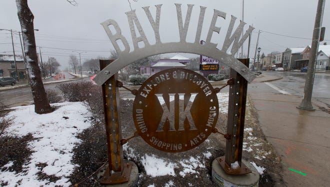 A sign greets motorists on S. Kinnickinnic Ave.  Wednesday, March 1, 2017 in the Bayview neighborhood of Milwaukee, Wis. A pair of new upscale apartment buildings, the Stitchweld apartments, with nearly 300 units, and the 69-unit Vue project will bring several hundred affluent residents to Bay View. The neighborhood is made up primarily of older, modest houses, many initially built for blue-collar workers.