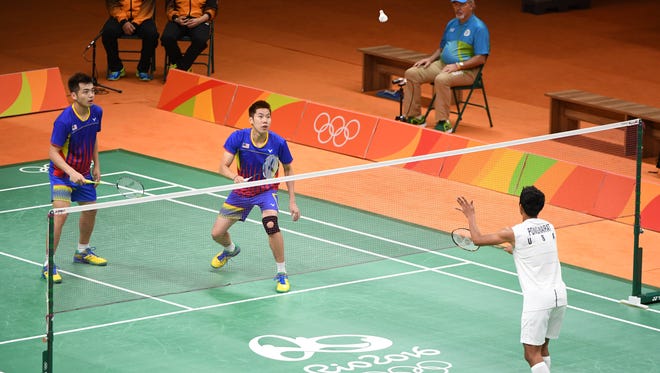 V Shem Goh and Tan Wee Kiong of Malaysia take on Philip Chew and Sattawat Pongnairat of the United States during the preliminary round in the Rio 2016 Summer Olympic Games at Riocentro - Pavilion 4.