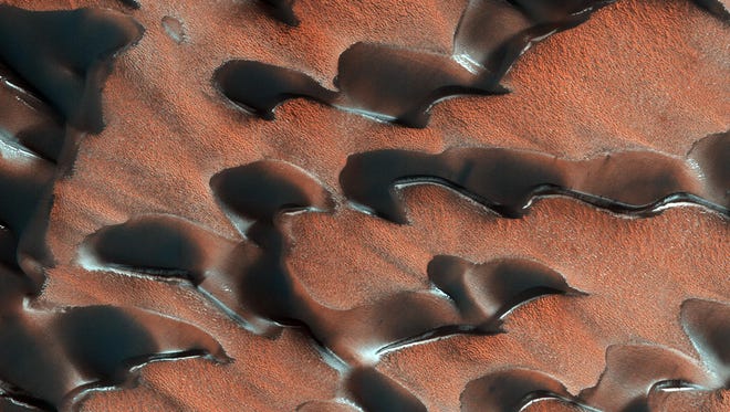 NASA's Mars Reconnaissance Orbiter (MRO) observed sand dunes in the north polar regions of Mars.